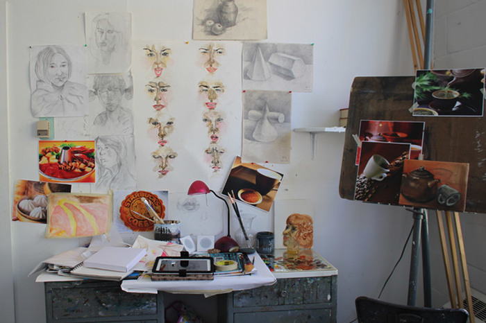A student studio space in Korsrud with artwork on display.