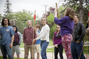 Students learn how to use an atlatl or spear thrower in the introductory Archaeology class.