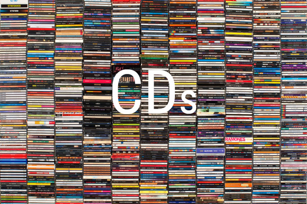 A stack of CDs with the word "CDs" in white on top