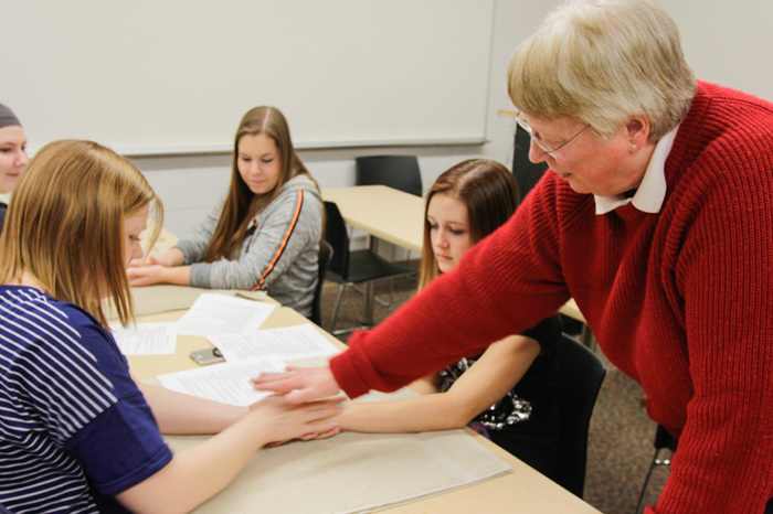 Jacki Wright's "Exploring Alternative Medicine" J-Term class learns about pressure points hands.