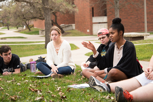 Students partaking in a discussion outside for the the Criminal Justice in the United States course.