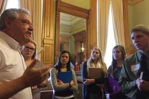 Representative Mark Smith speaking with Luther students in his office at the Iowa State Capitol.