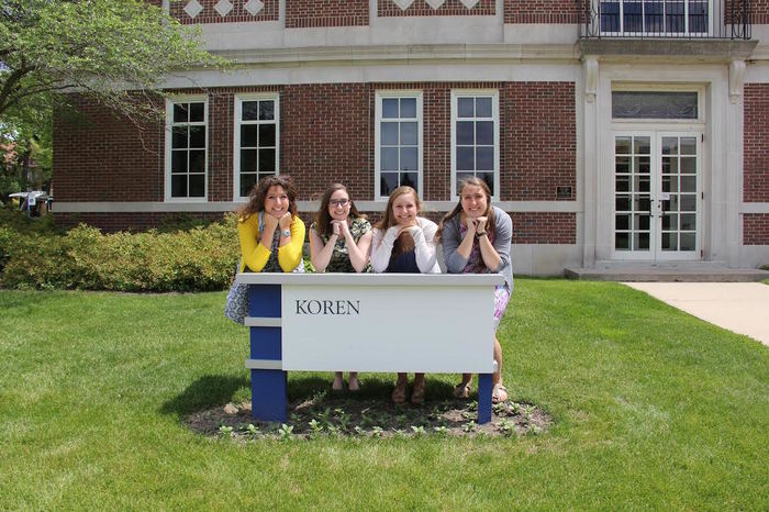 Luther education students with Koren sign.