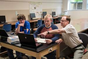 Professor Wilkerson with students Torger Jystad '19 and Issac Stivers '19 debating how to best analyze their research findings.