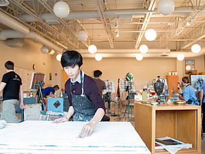 A student prepares for his art project in Ben Moore's Painting class.
