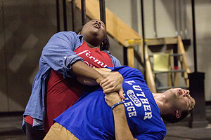 Two students rehearse for Rent the musical.