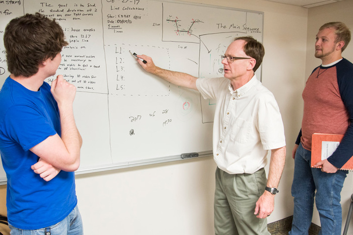 Professor Wilkerson conducting research with students (left) Erik Floden ('18) and (right) Torger Jystad ('19)