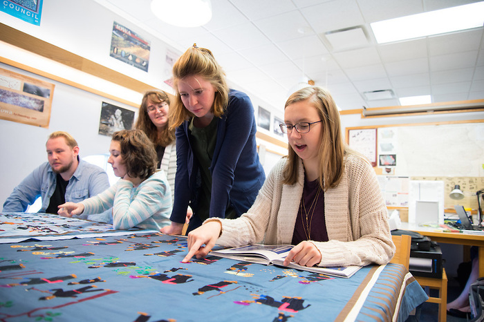 Anthropology student workers are tasked with analyzing and categorizing Luther College's sizable collection of Hmong tapestries and lineages.