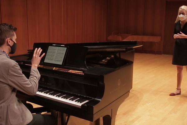 Vocal Coach Nicholas Shaneyfelt working with a vocalist in the Noble Recital Hall.