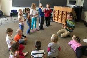 Music education student works with students in area school.