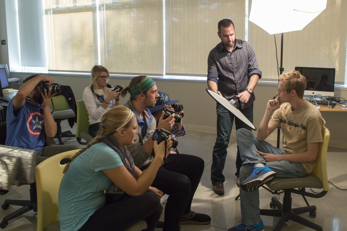 Luther students work with Professor Aaron Lurth for a photography class.