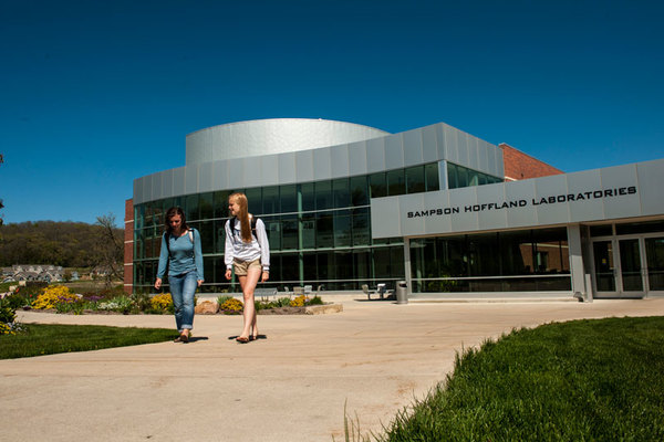 Students walking in front of Sampson Hoffland Laboratories.