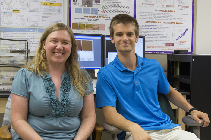 Physics student and faculty member pose for a photo after they completed a collaborative research project together.