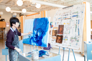 A student paints in a class taught by Professor Ben Moore.