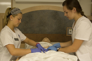 Nursing students participating in the wound care lab.