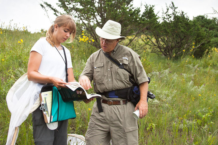 Professor Kirk Larsen with a student conducting research in Luther's natural areas