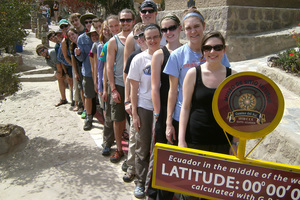 Students pose for a photo taken at the Equator, near Quito, Ecuador.