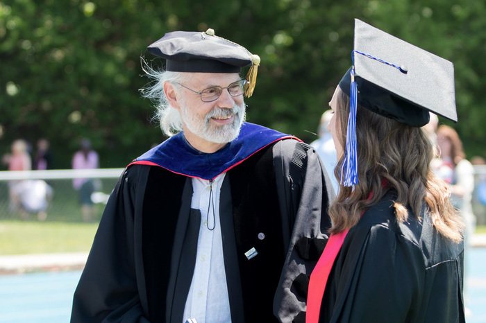 Professor Storm Bailey speaking with Emily Holm '16 at Commencement