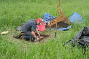Anders Hopkins (’15) excavates a test unit on a prehistoric site during the summer archaeology field methods course.