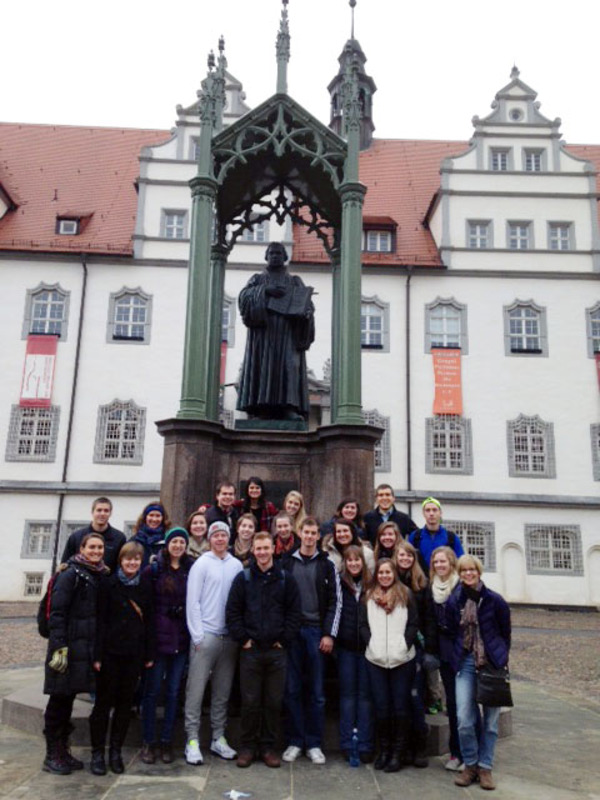 Students in front of Martin Luther Statue in Wittenberg, Germany as part of REL 239 J-term 2015.